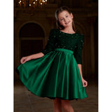 Green rayon girl's western dress with short sleeves and round neck, solid pattern