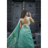Women's sky-colored cotton printed saree with unstitched blouse, 5.5Mtr length on model for an elegant Indian look