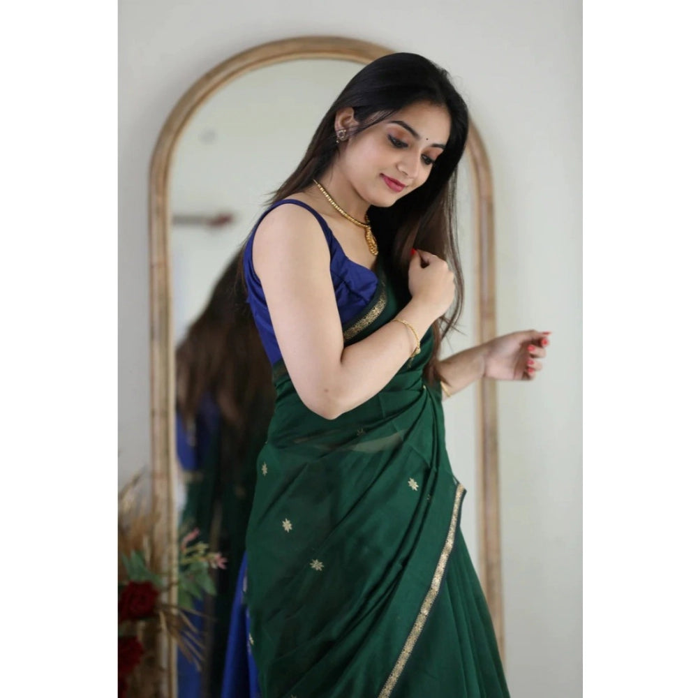 Green cotton printed saree with unstitched blouse, vibrant pattern design on display
