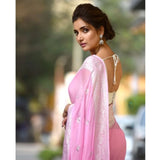 Women's cotton printed saree with unstitched pink blouse, vibrant design on display