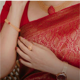 Red silk printed saree with unstitched blouse (5.5mtr) on mannequin