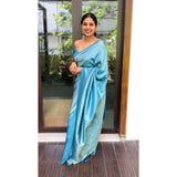 Sky blue silk printed saree with unstitched blouse, vibrant floral design on display