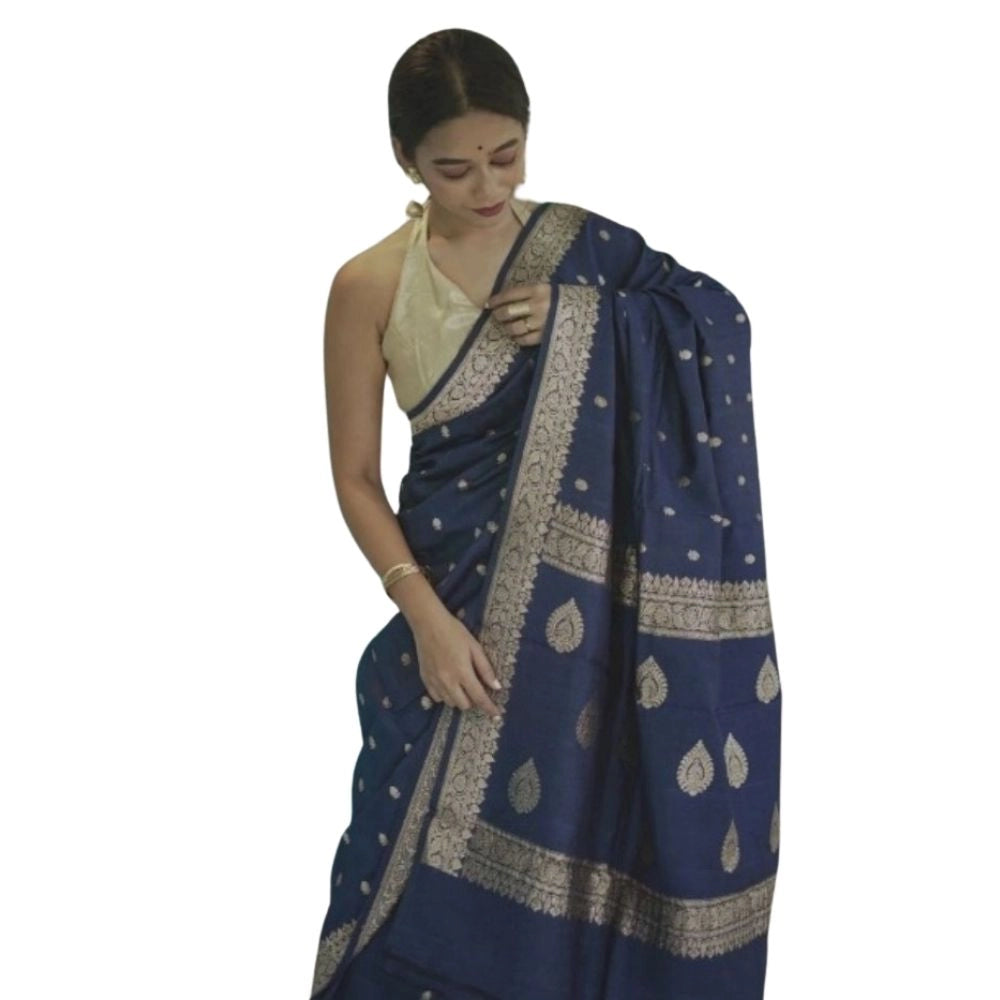 Navy blue cotton printed saree with unstitched blouse on mannequin, vibrant pattern details visible