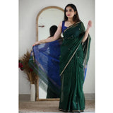Green cotton printed saree with unstitched blouse, vibrant Indian fashion wear on mannequin