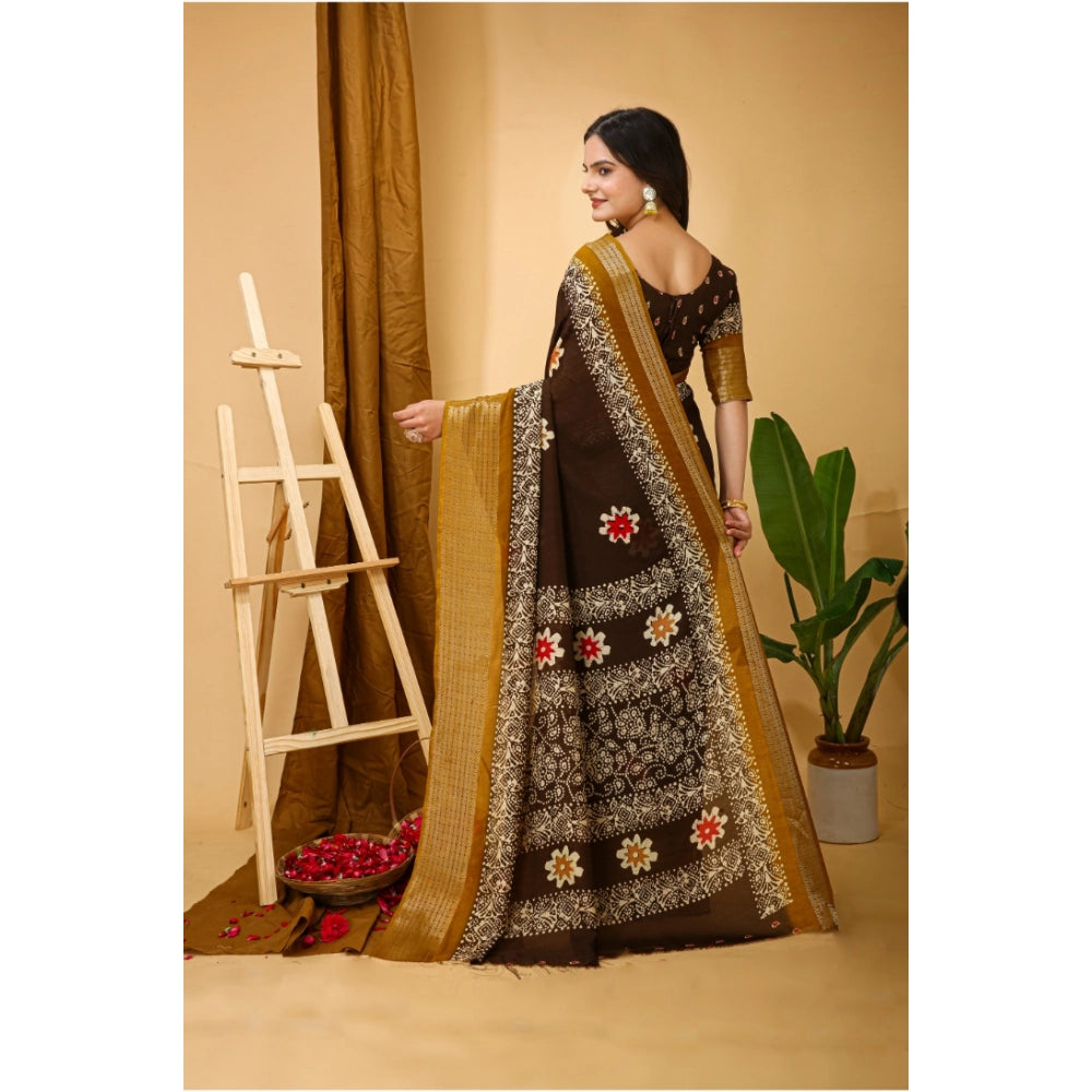 Brown soft marshmallow fabric kalamkari printed saree with unstitched blouse, traditional Indian women's attire on display