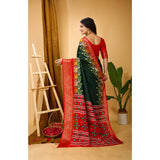 Green soft Dola cotton kalamkari printed saree with unstitched blouse, vibrant traditional Indian wear on mannequin