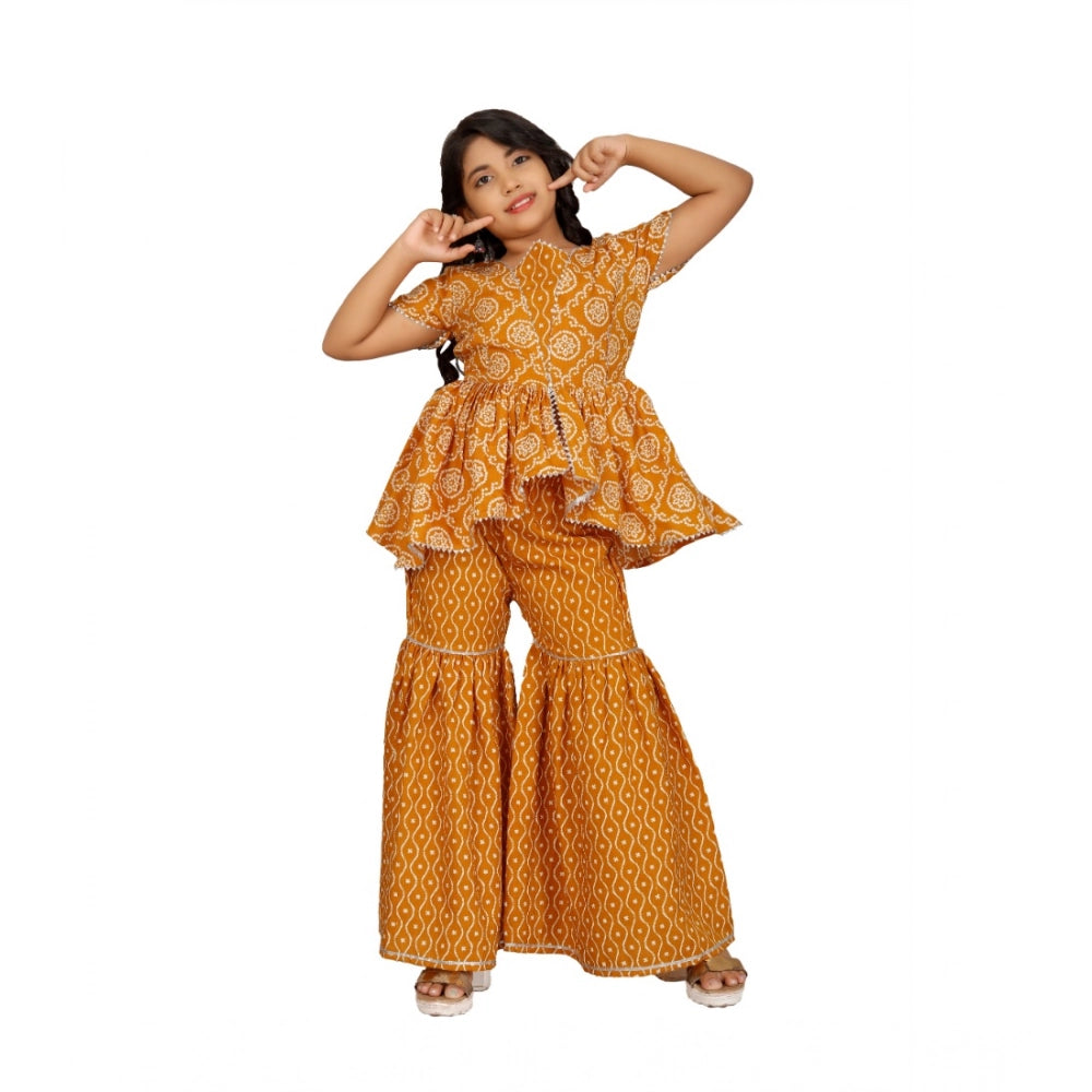 Mustard cotton-rayon printed top and sharara set for girls, half sleeve round neck style with vibrant pattern