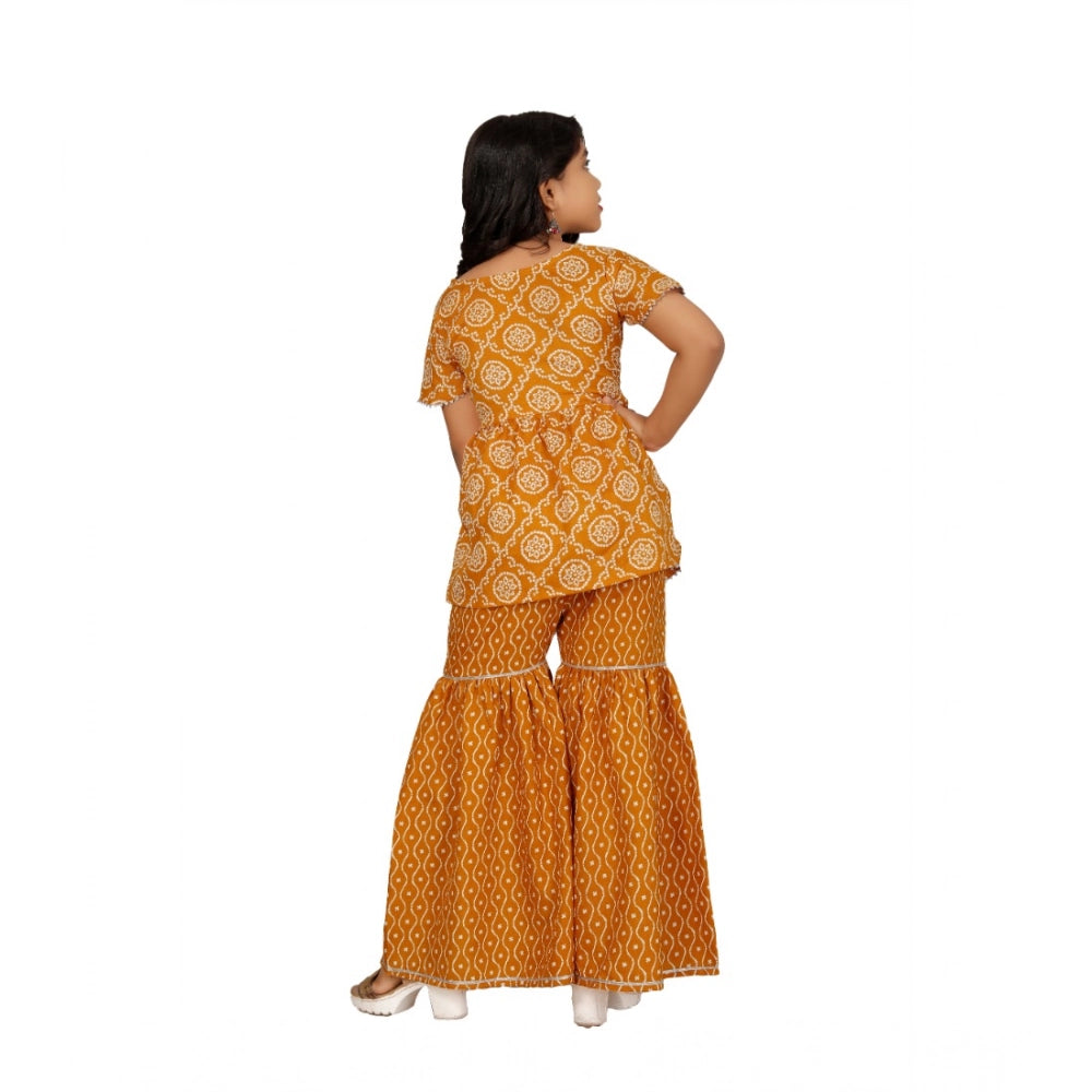 Mustard cotton-rayon printed top and sharara set for girls, half sleeve and round neck design