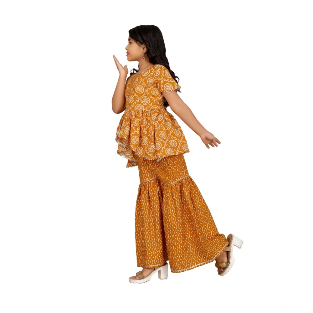 Mustard cotton rayon printed top and sharara set for girls - half sleeve round neck design