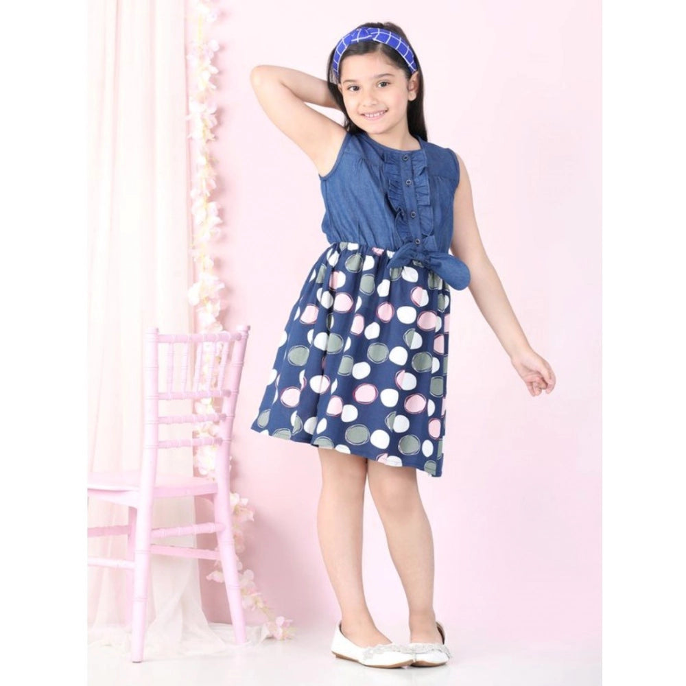 Blue denim rayon printed sleeveless round neck dress for girls, above knee length on model