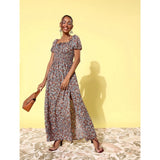 Woman in moss floral dress