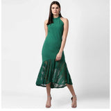 Green sleeveless dress with a close neck