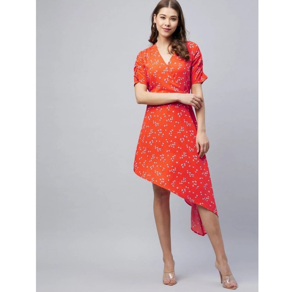 A woman in an orange v-neck polyester floral short sleeve dress