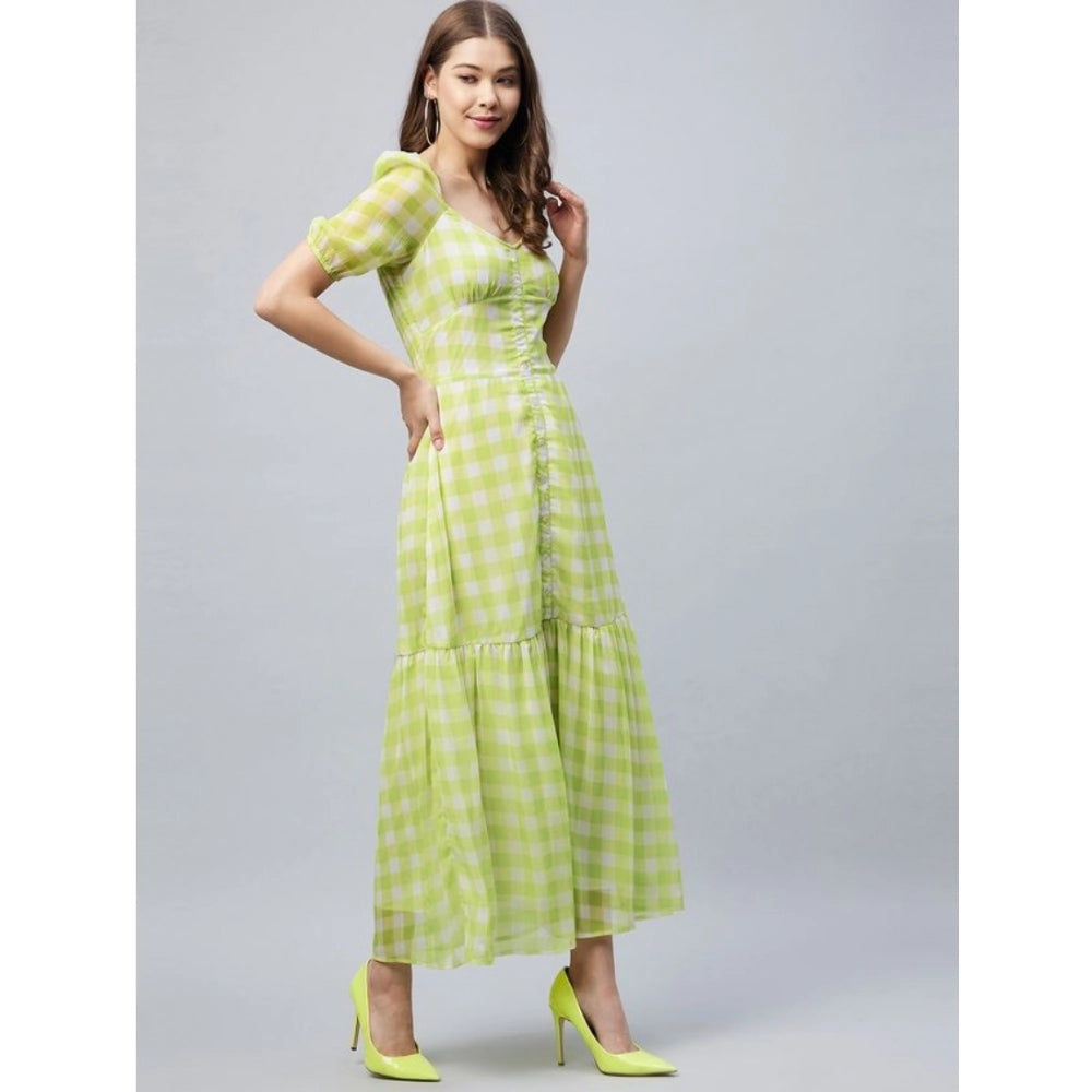 A woman wearing a lime green polyester-cotton blend checkered square neck half sleeve dress