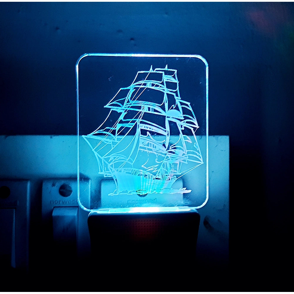 A blue neon sailboat on an ac adapter night lamp