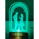 Clear acrylic lamp with green light and romantic couple design