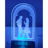 White and blue night lamp with an ac adapter design featuring a romantic couple