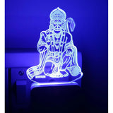 The image is of a night lamp featuring an ac adapter in the shape of Lord Anjaneysa. It has blue neon lighting and appears to be made from metal, possibly serving as a night light for charging purposes