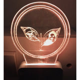 Lit ac adapter night lamp with admk logo and two figures design
