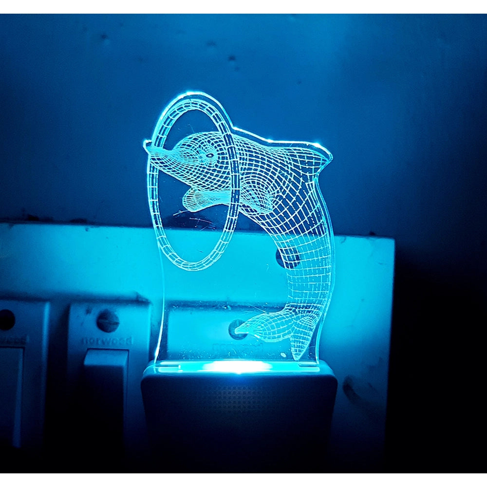 Clear glass night lamp with illuminated dolphin figure, ac adapter design