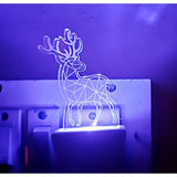 A purple LED night lamp in the shape of a deer with antlers, designed as an AC power adapter cover