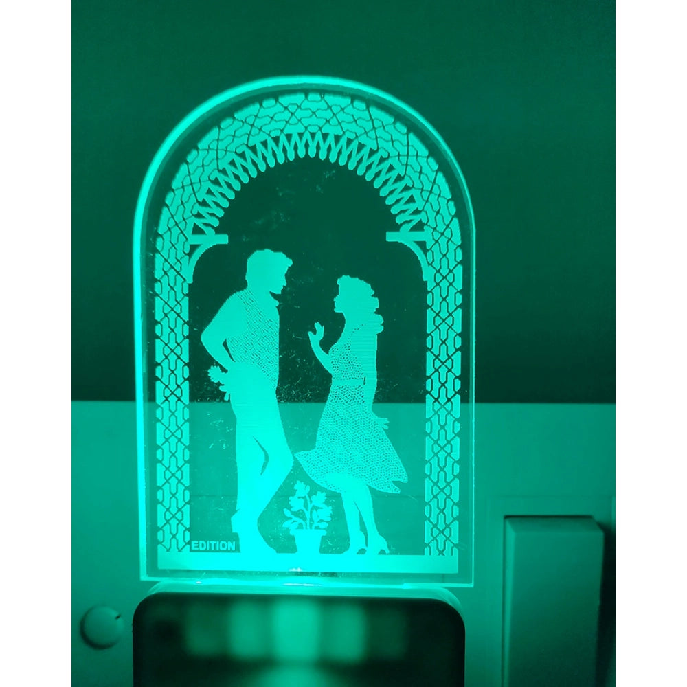 Black and white night lamp with glowing couple, metal base
