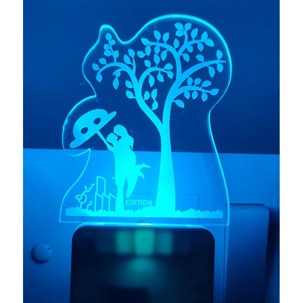 A romantic night lamp featuring a tree with leaves and a couple sitting under it