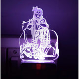 Night lamp featuring engraved Shree Krishna and AC adapter design, glowing in purple light