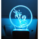 Blue night lamp with AC adapter, person illustrated