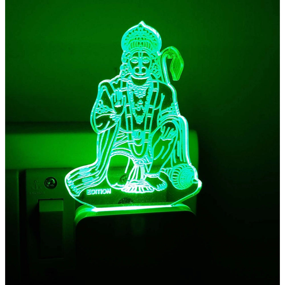 This is an LED lamp with the design of Lord Anjaniya, a common Indian night lamp often used as a religious symbol. It's white in color and features intricate details, illuminating with green light when powered on