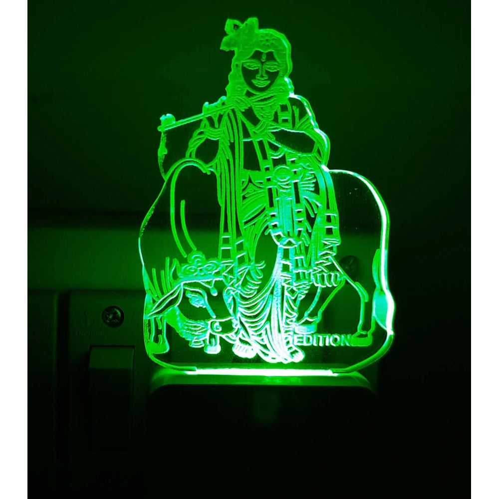 Green illuminated night lamp with Hindu deity figure and cow design