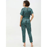 Green polyester polka dot jumpsuit with short sleeves