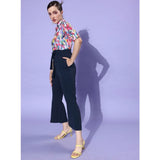 Women's navy blue multicolored print jumpsuit with rolled up sleeves and cropped trousers