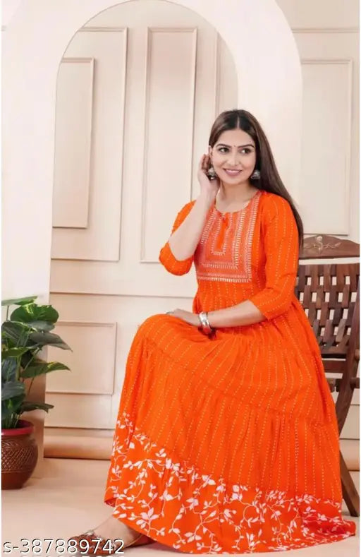 Orange embroidered rayon anarkali kurti, three-quarter sleeves, solid combo, S-XXXL. Close-up of intricate embroidery on Indian traditional clothing