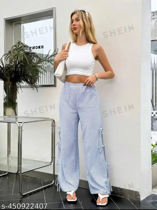 Blue denim tie strides, white top, white sneakers