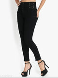 Black high-waisted bell bottom jeans with exposed zip fly and a thin black belt