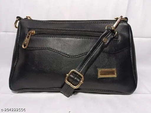 Black sling bag with strap closure, multiple pockets and compartments
