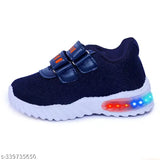 Black and orange footwear with LED lights
