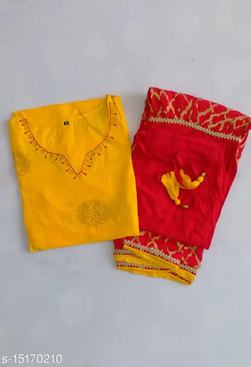 A yellow embroidered rayon kurta paired with matching red bottoms