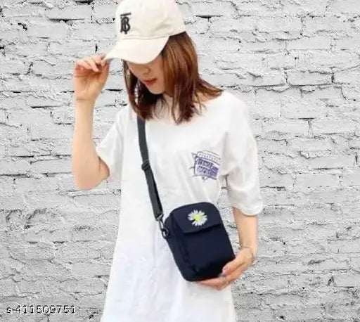 Black floral print crossbody bag with adjustable strap, functional side pocket and main compartment, ideal accessory