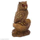 Synthetic resin Vastu owl statue sitting on gold Yuan Bao, symbolizing wealth and good fortune in Indian Feng Shui and Hinduism