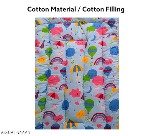 Multicolor cotton baby mattress with rainbow and cute character design.