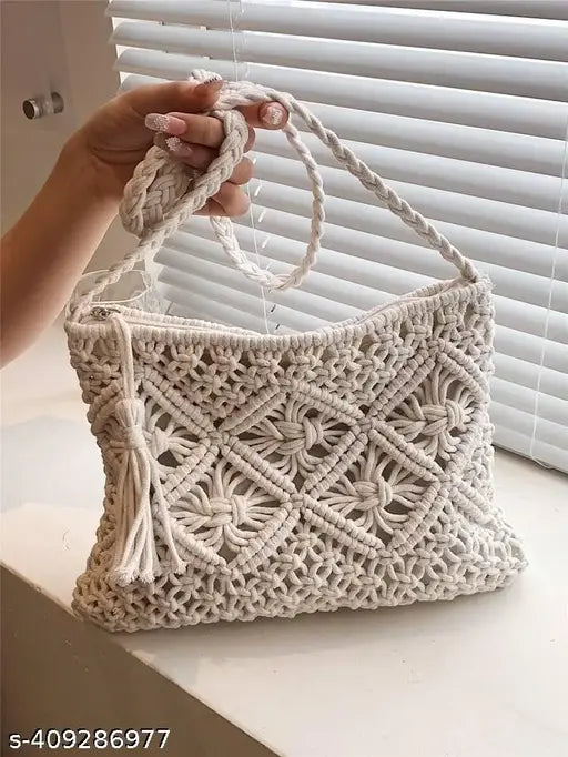 Vertical handmade cream macrame clutch with tassel. One main compartment with a zip closure. Size: Height 20 cm, width 30 cm. Pack of 1