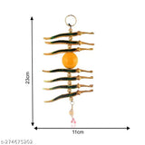 Metal Nimbu Mirch yellow wall hanging, removes negativity, Feng Shui decorative showpiece for Vastu-compliant home décor, measures 9cm x 22.5cm x 9cm, handcrafted in India