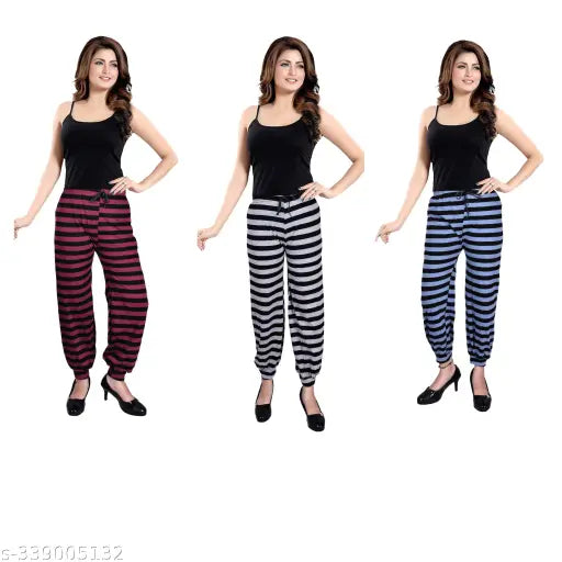 Set of four stylish striped pyjamas in black, navy blue, red, and pink fabric; elastic waistband