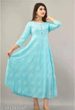 Sky blue printed cotton kurti, three-quarter sleeves, vibrant floral print. Single size options available on a size chart. Made in India