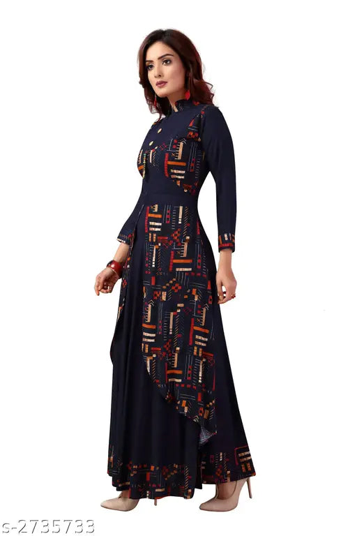 Rayon printed long kurta with ankle length, neck collar and three-quarter sleeves by Madhuram Textiles. Ideal for parties and festivals. High-quality rayon fabric, trendy 3/4 sleeves, front side buttons, and a modern Chinese collar. Made in India