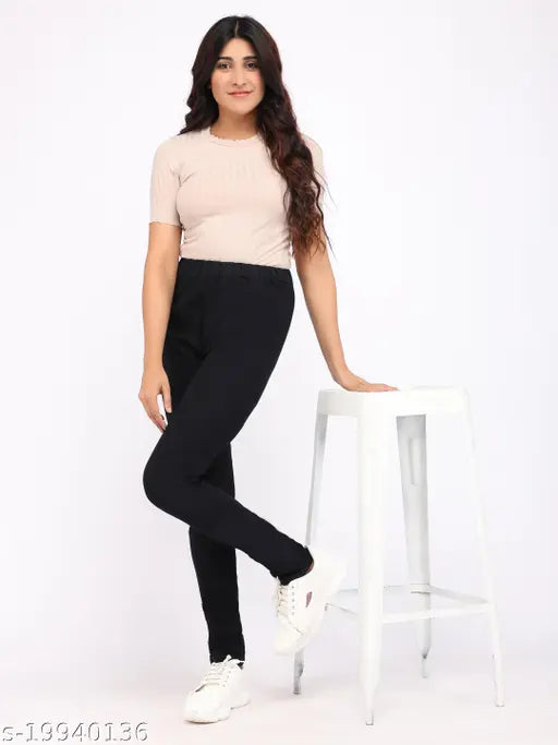 Solid black denim jeggings for women, stretchable medium waist and elastic closer ankle length