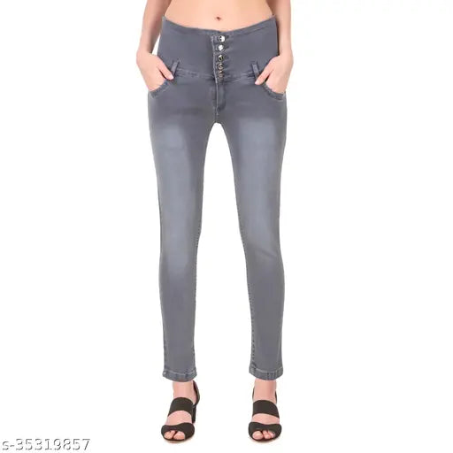 Blue skinny jeans with button fly and zippered side pockets, cropped length