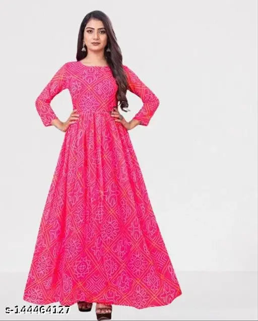 A woman in a long pink bandhini kurta
